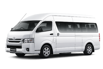 Toyota Hiace Commuter putih tampak serong depan dan samping untuk layanan sewa Hiace Jakarta dengan driver profesional