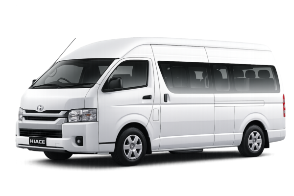 Toyota Hiace Commuter putih tampak serong depan dan samping untuk layanan sewa Hiace Jakarta dengan driver profesional