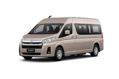 Toyota Hiace Premio Luxury coklat muda metallic tampak serong depan dan samping untuk layanan sewa Hiace Luxury Jakarta dengan driver profesional